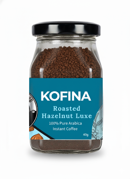 Kofina Roasted Hazelnut Luxe – premium instant coffee with smooth roasted hazelnut flavour, crafted from 100% pure Arabica beans for a nutty, aromatic brew.